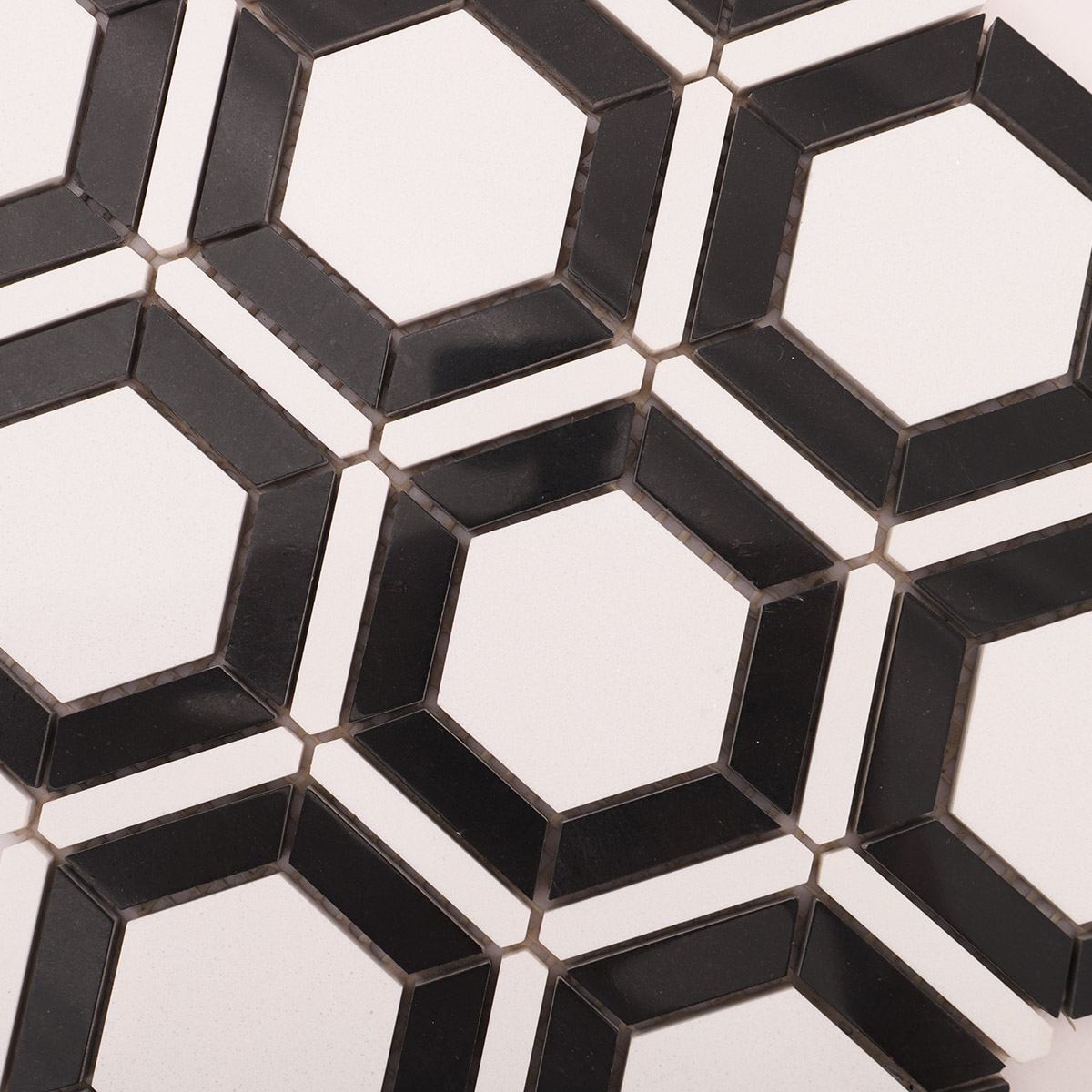 Close-up of white and black hexagon marble mosaic tiles