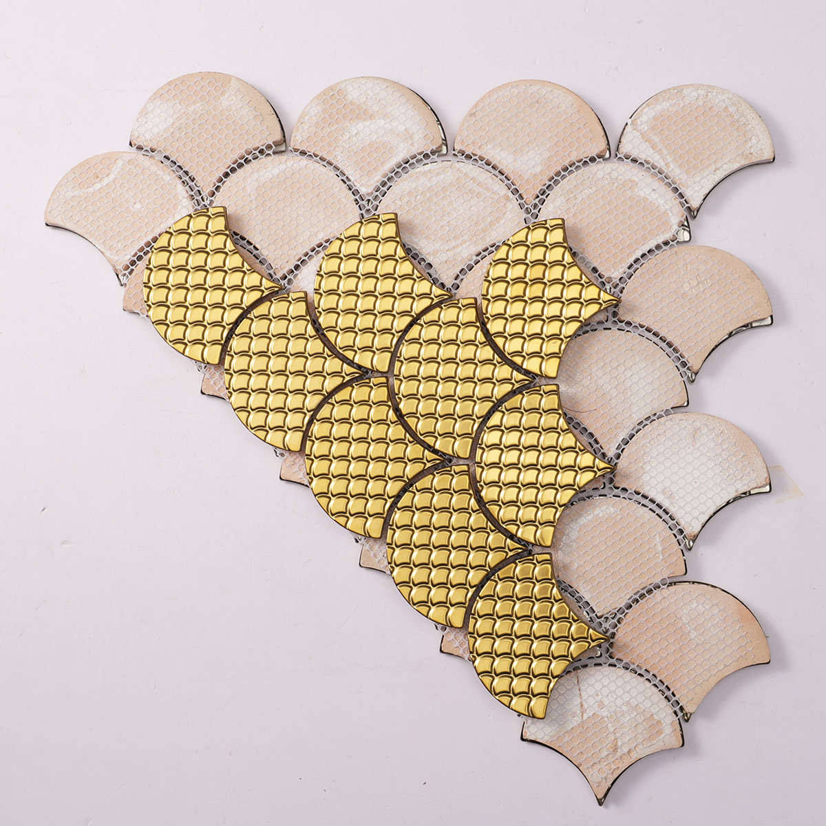 Folded back side of 3D gold metal shell shaped mosaic tiles.