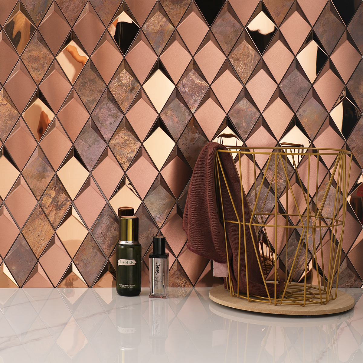 3D diamond stainless steel and copper mosaic tiles on a stylish bathroom wall.
