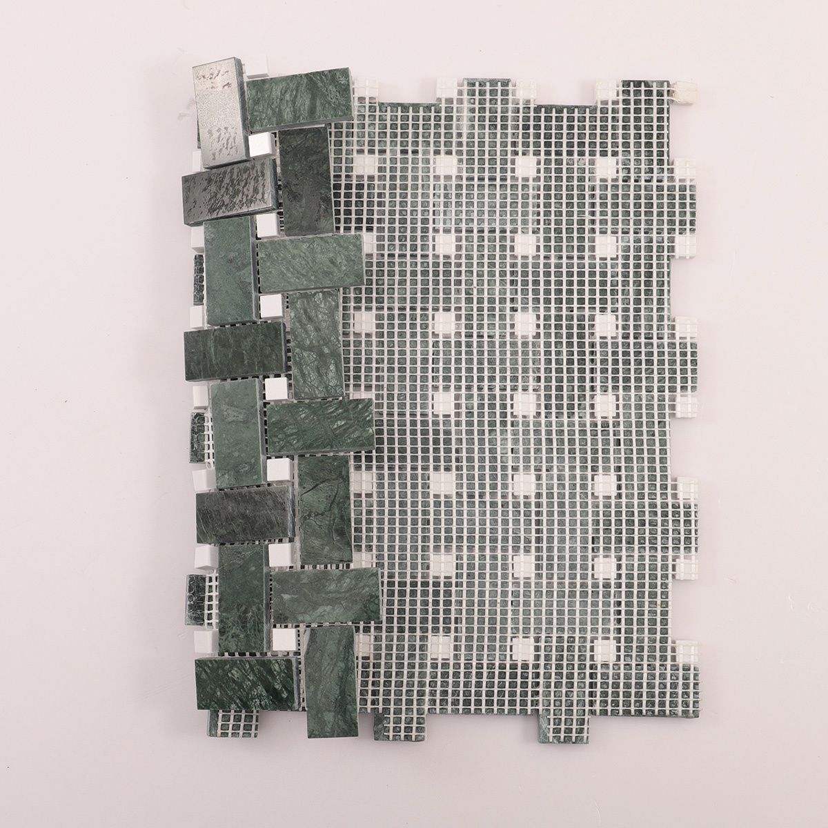 Rear folded view of Verde green basketweave marble mosaic tiles.
