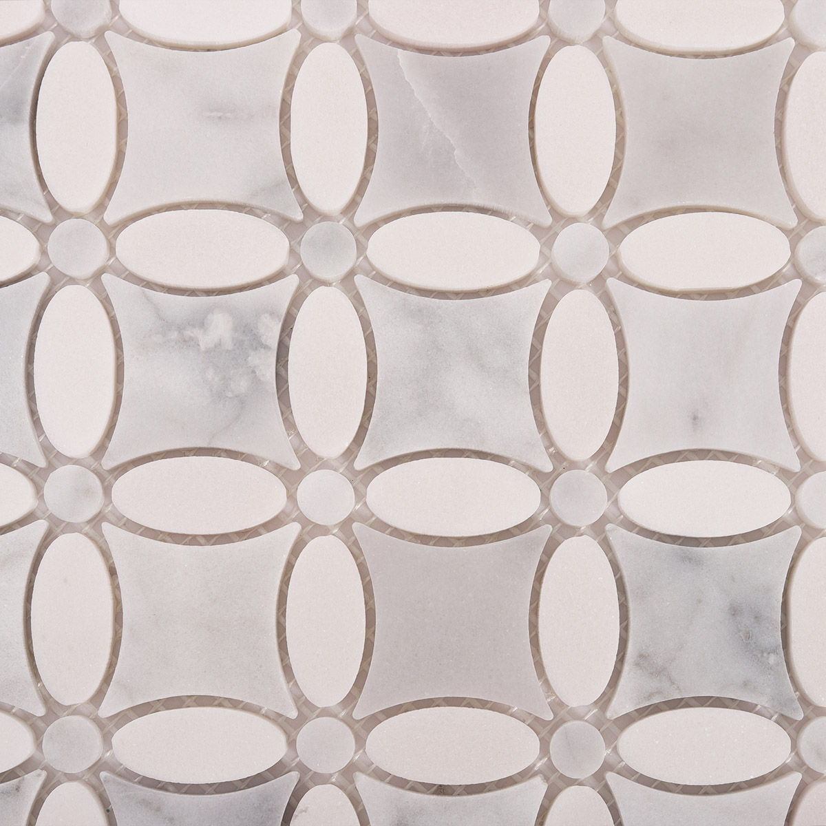 Close-up view of Carrara white flower marble mosaic tiles