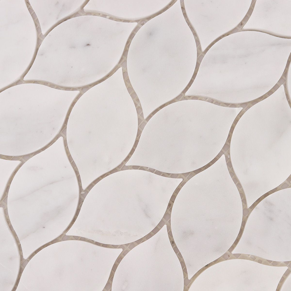 Close-up of Carrara white leaf marble mosaic tiles