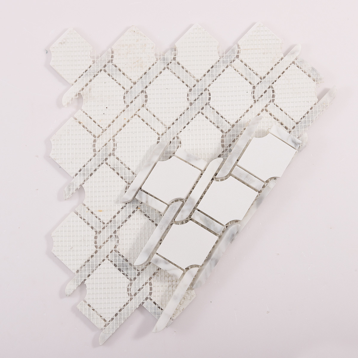 Folded back side of White Fog Chain Link stone mosaic tiles