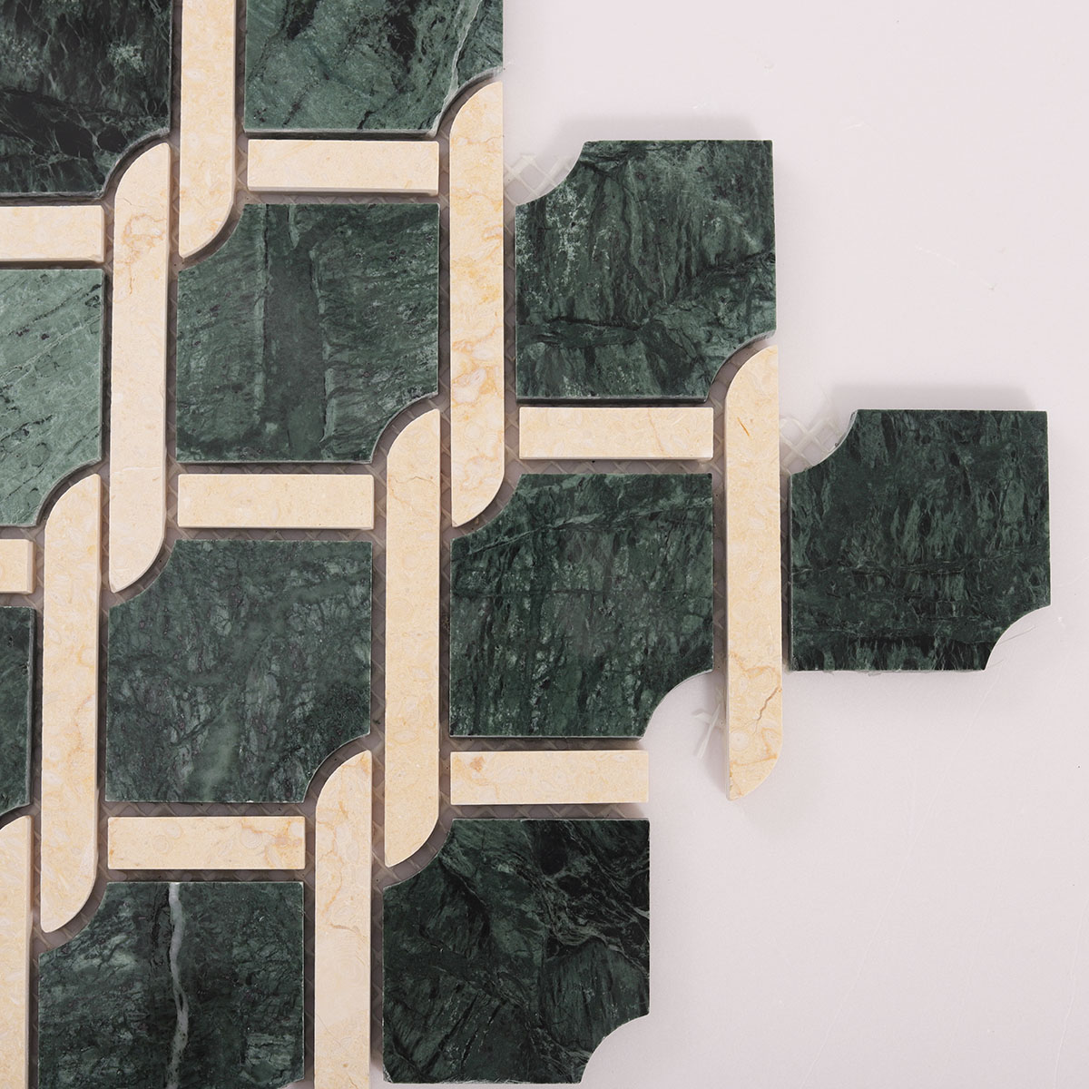 Close-up of Rockart Medallion Green polished marble mosaic tiles