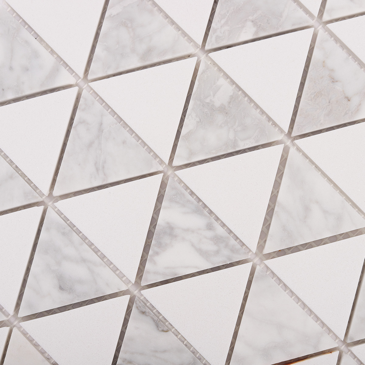 Close-up view of White Equilateral Triangle Honed Stone Mosaic Tiles