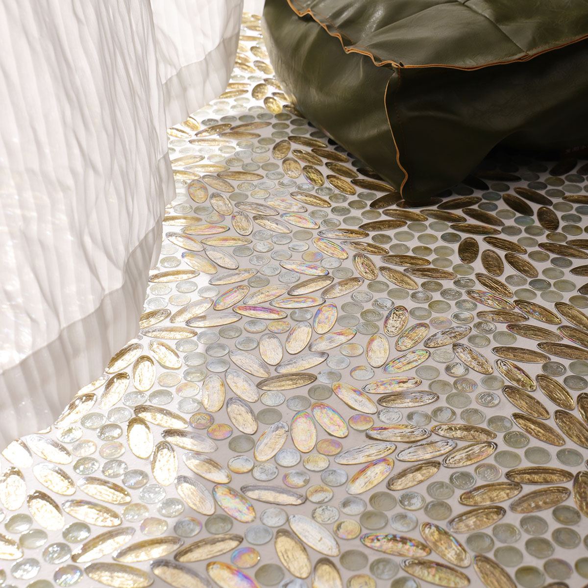 Room with Gold Glass Flower Art Mosaic Floor Tiles, featuring white curtains and green pillows.