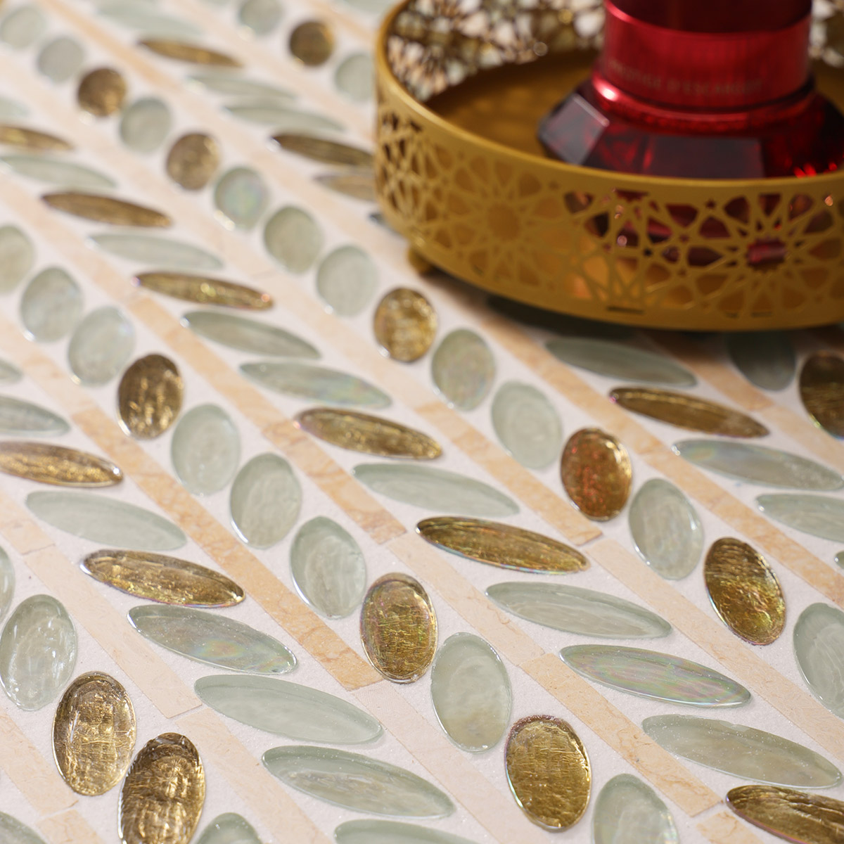 Skincare products on Glass and Marble Oval Leaf Mosaic Tiles floor setting.