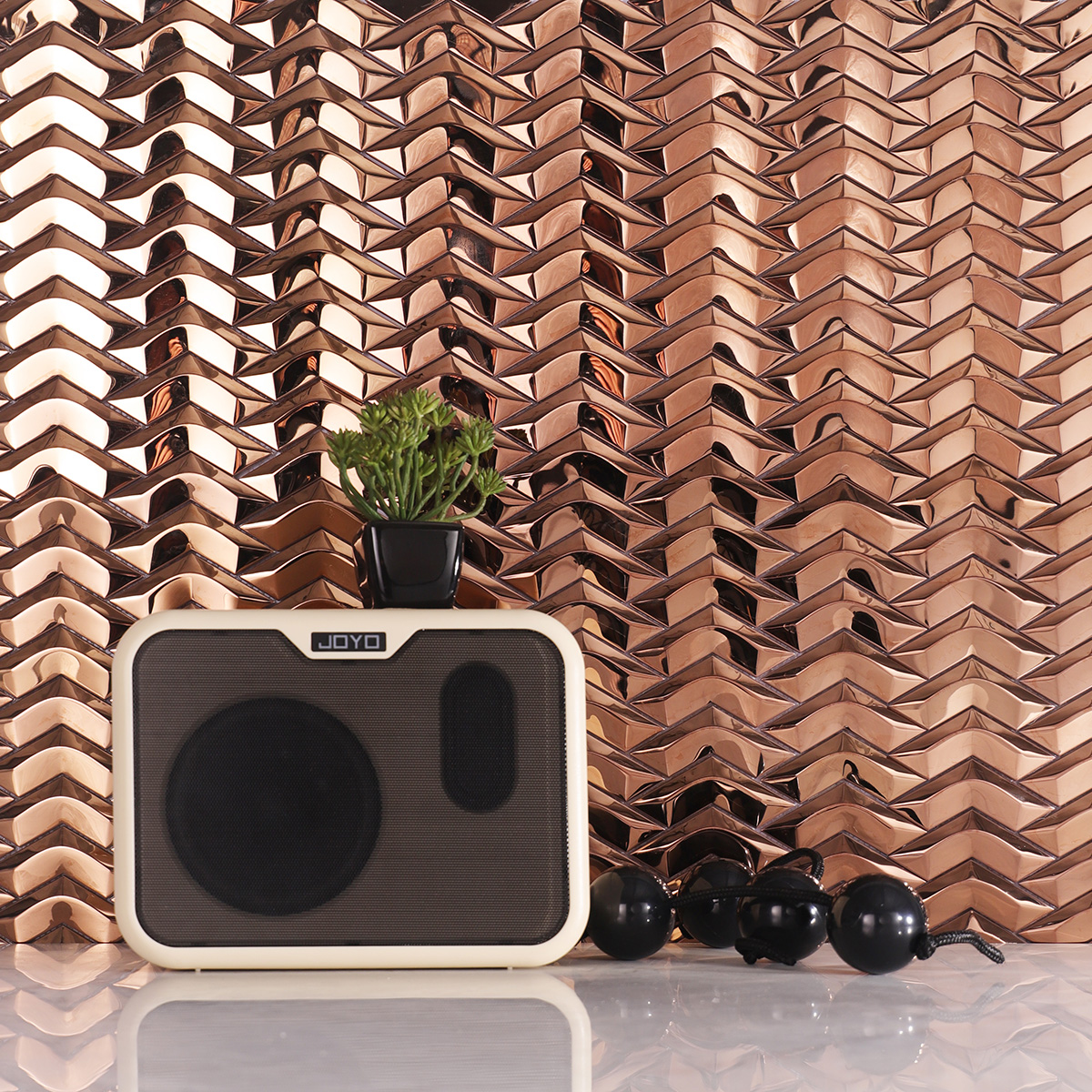 3D Herringbone Rose Gold Mirror Metal Mosaic Wall Tile in a modern interior