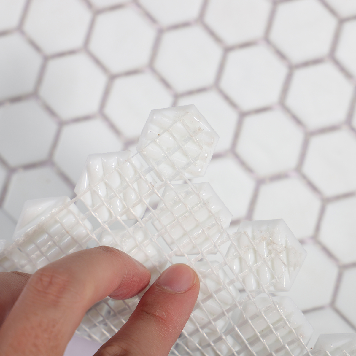 Rear view of White Hexagon Glass Mosaic Tile, highlighting mesh backing connection