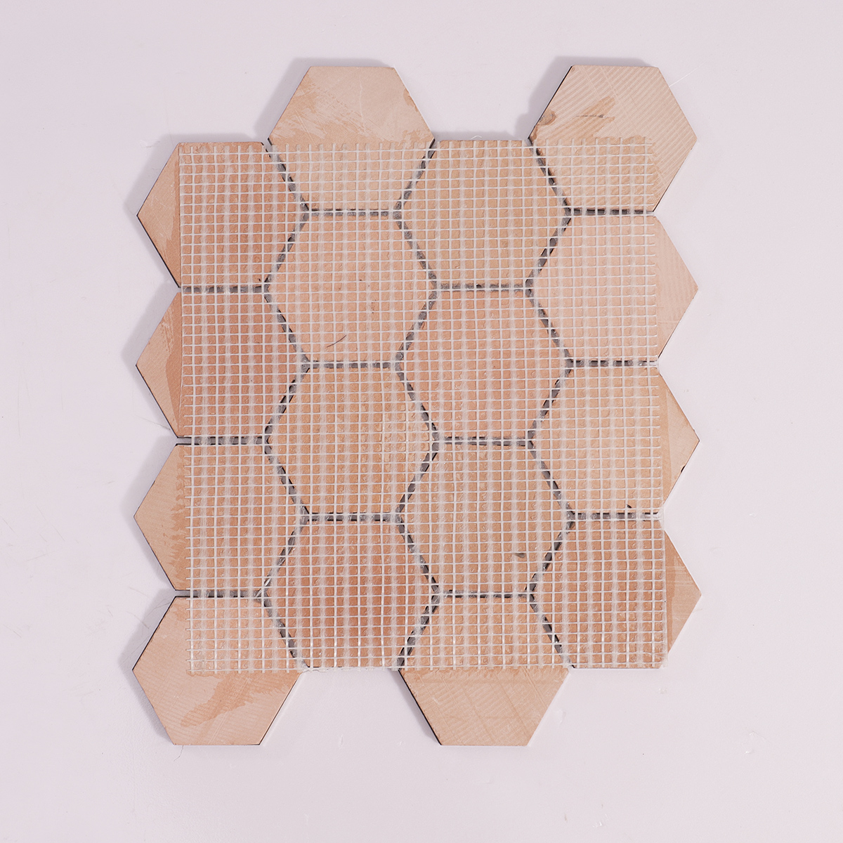 Backside of Honeycomb Hexagon Brushed Metal Mosaic Tile with Mesh Backing