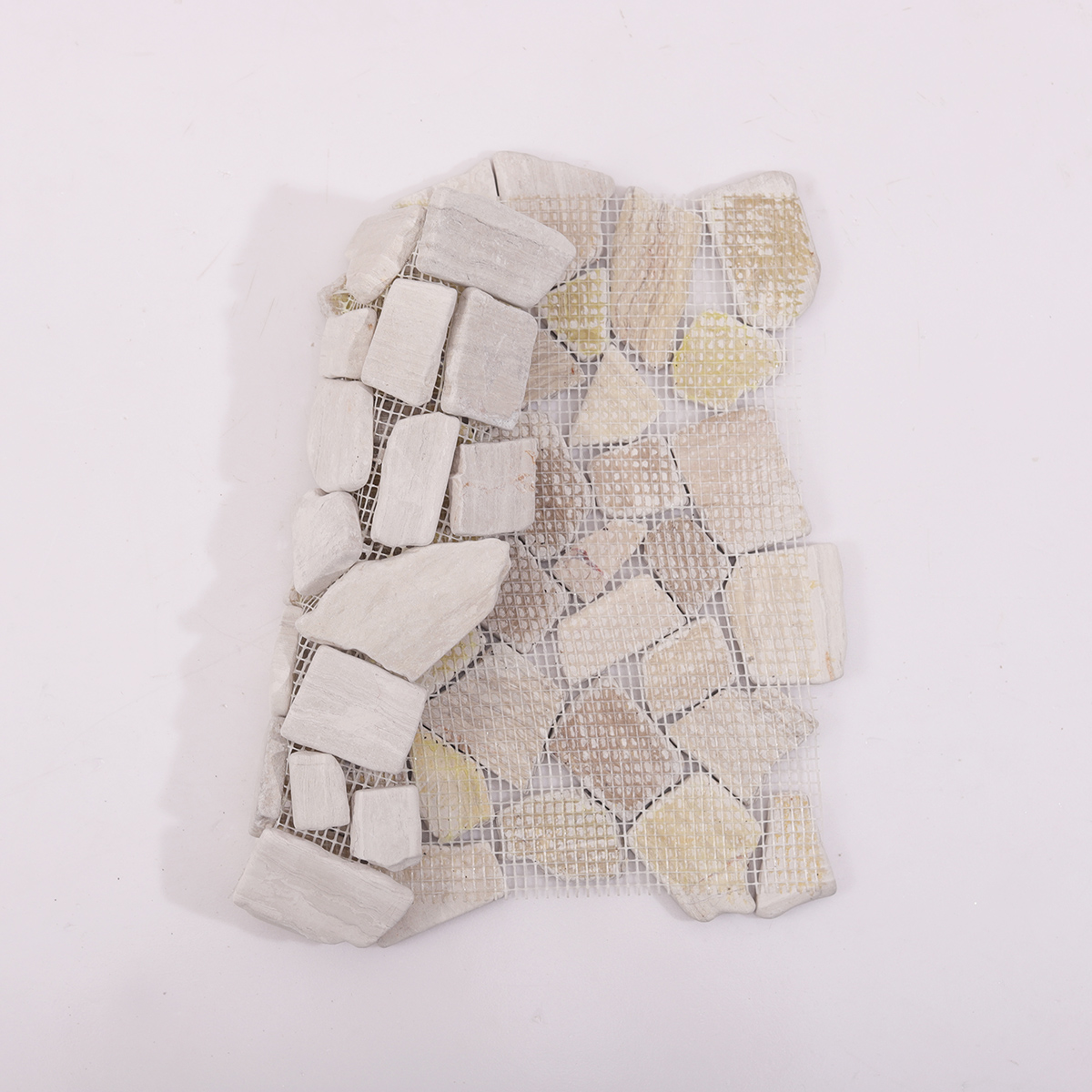 Backside of Grey Shaved Pebble Stone Mosaic Tile with Mesh Backing