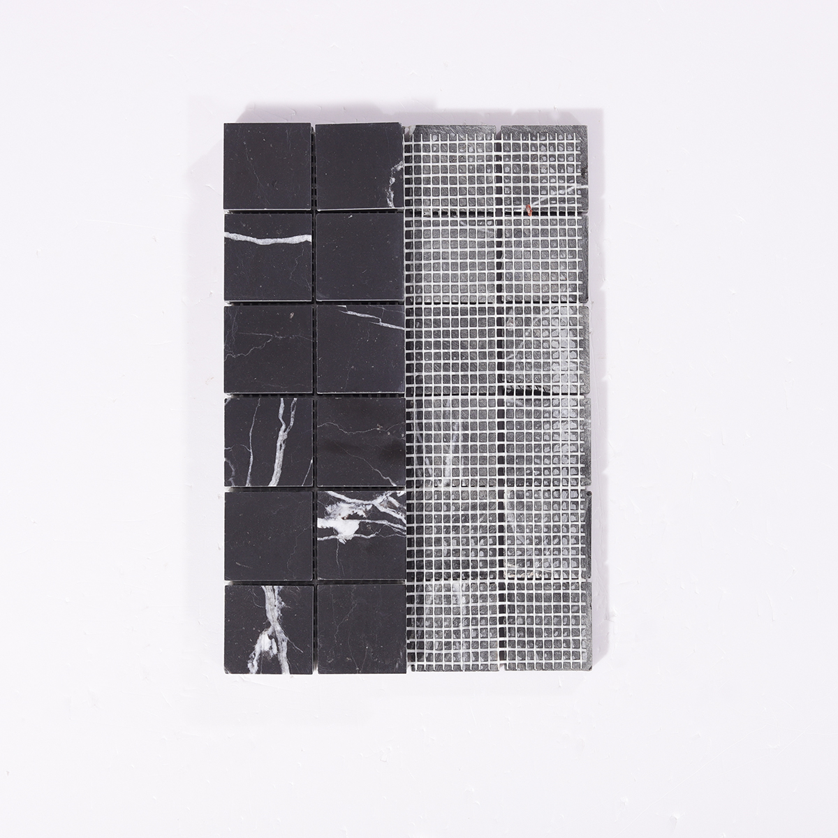 Back view with mesh backing of Nero Marquina black square marble mosaic tiles.