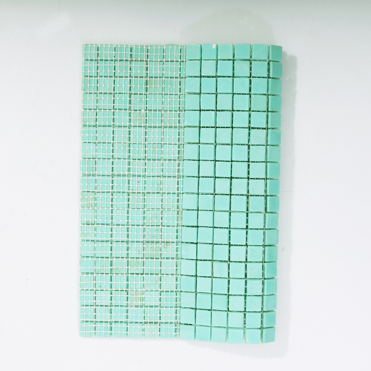 Backside of Teal Square Glass Mosaic Tile with Mesh Backing
