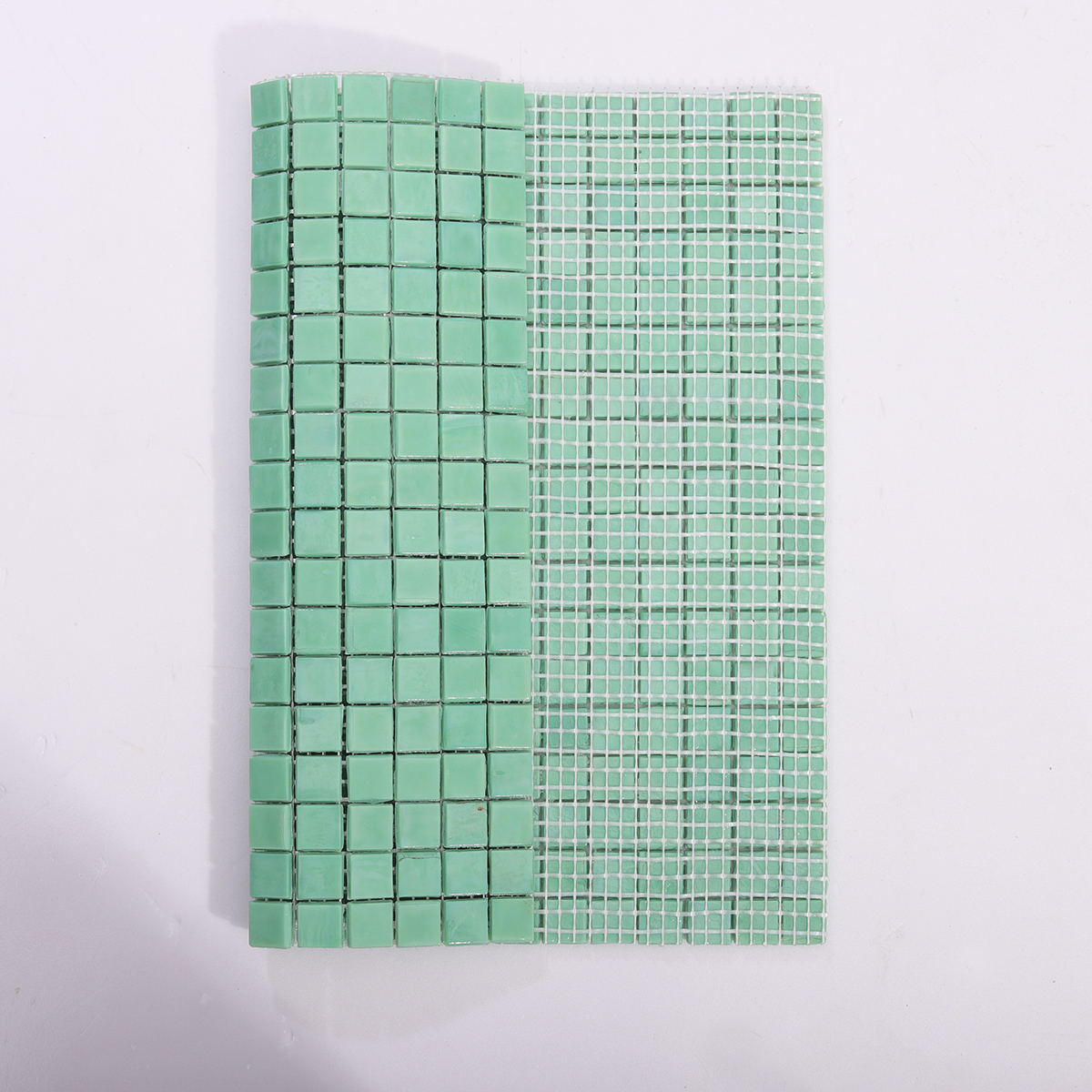 Backside of Mint Green Glass Mosaic Tile with Mesh Backing