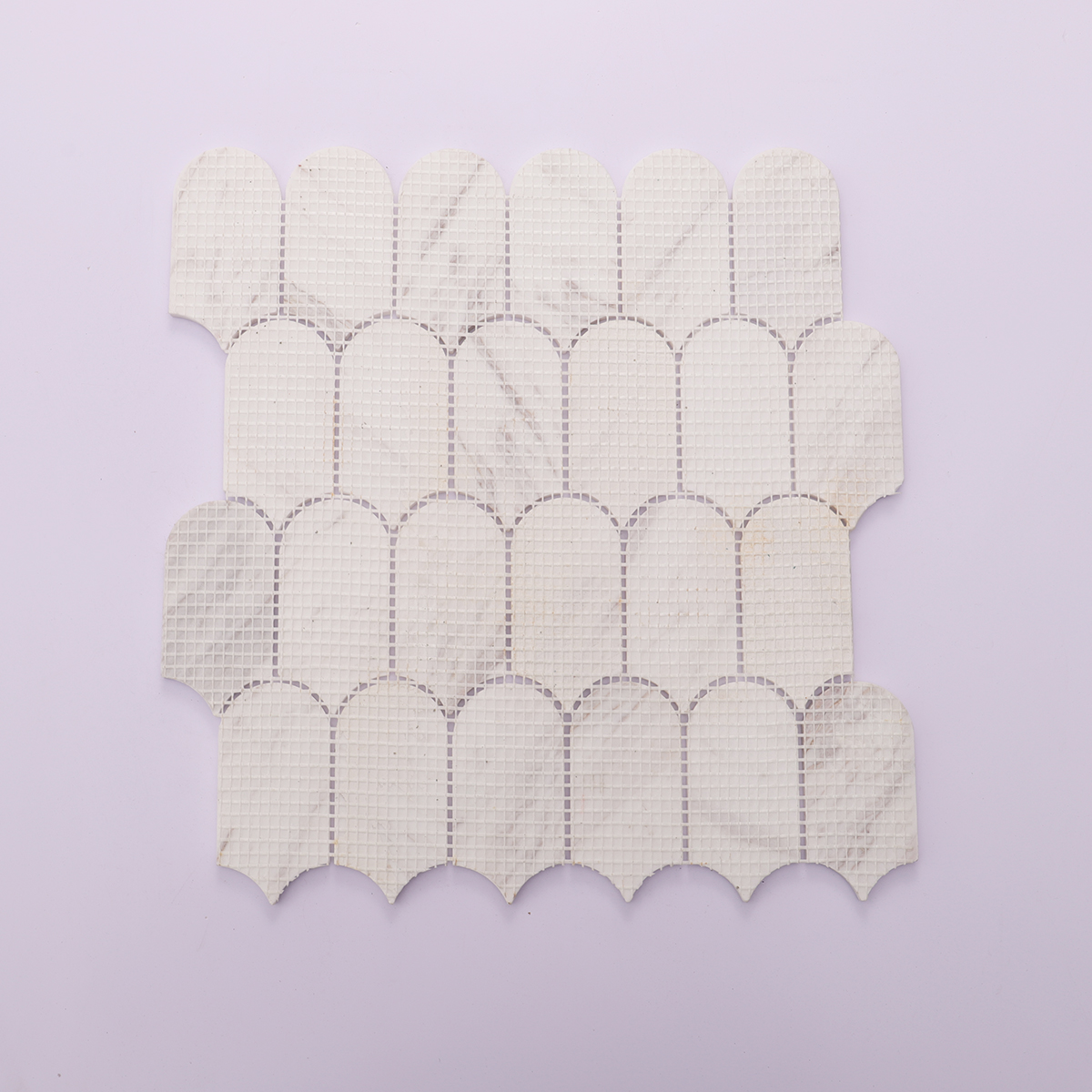 Back mesh view of white marble mosaic tile with scallop pattern