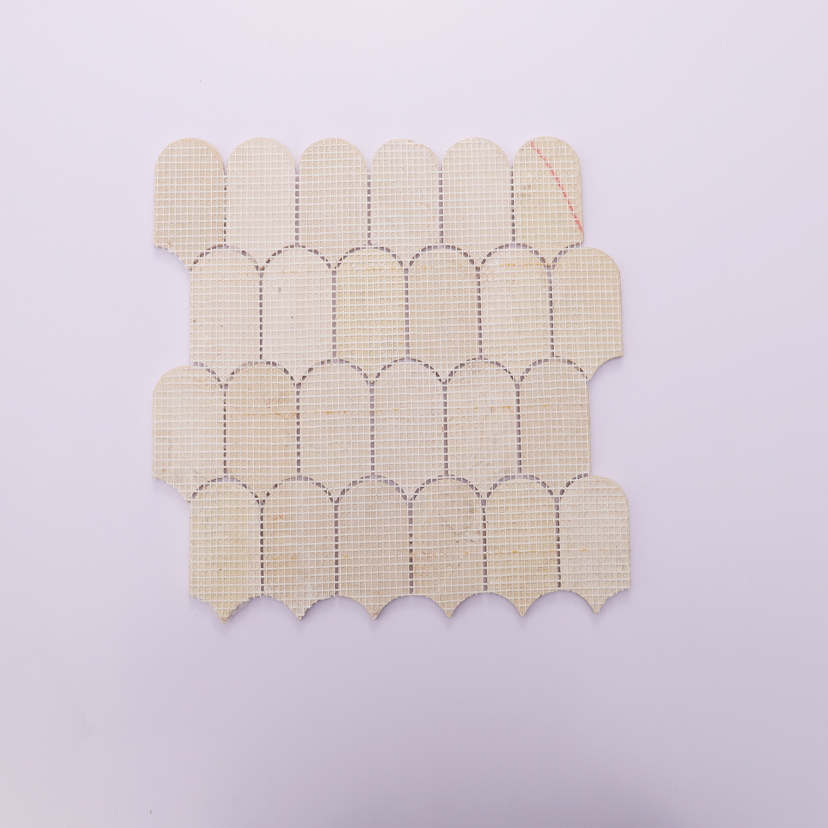 Back mesh view of beige marble mosaic tile with scallop pattern