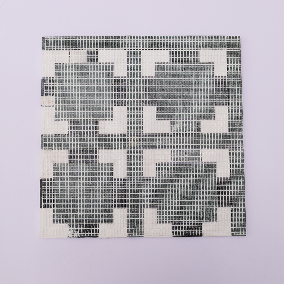 Back view of the stone mosaic with mesh backing for easier installation