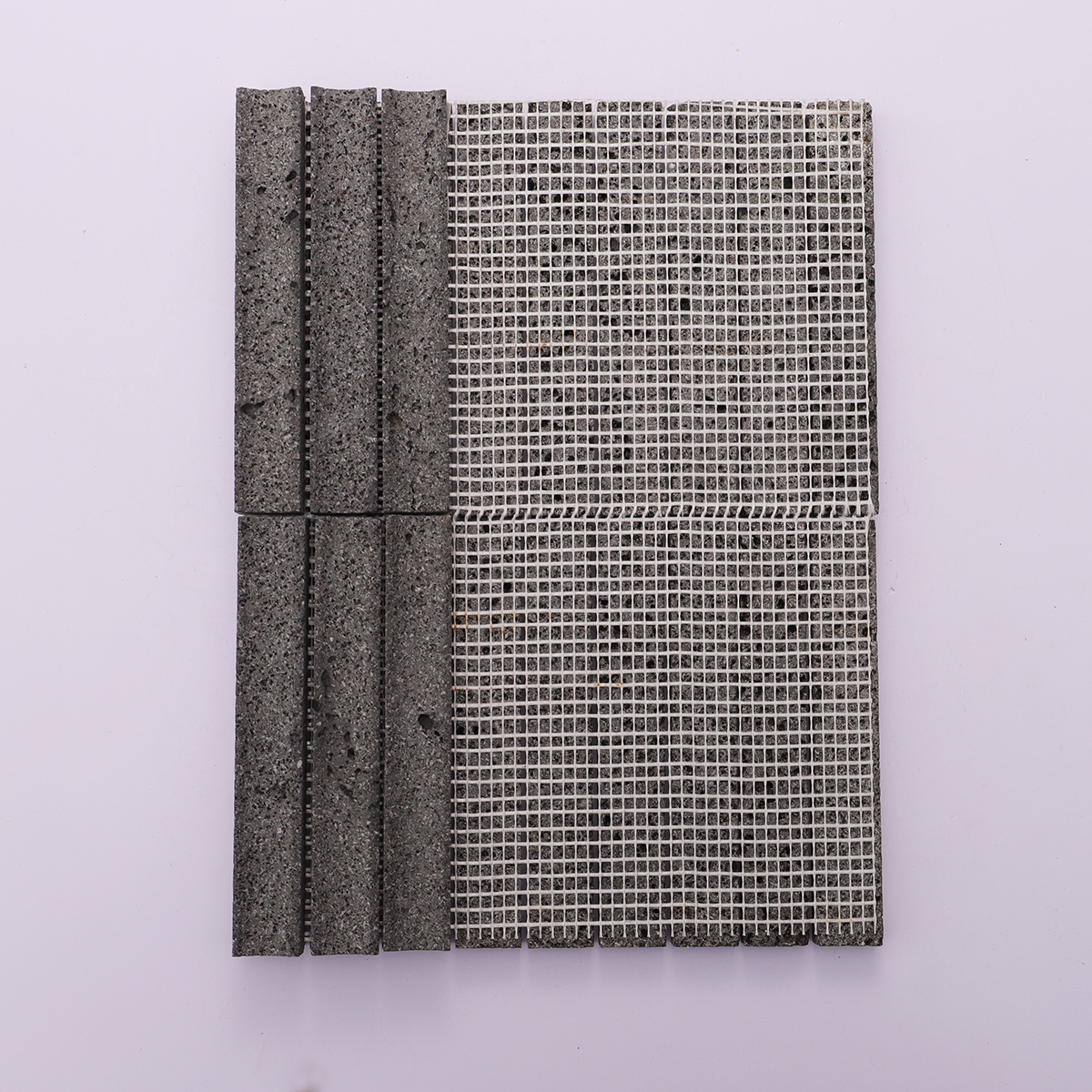 Back view of the black lava stone mosaic tile with grid backing for easy installation