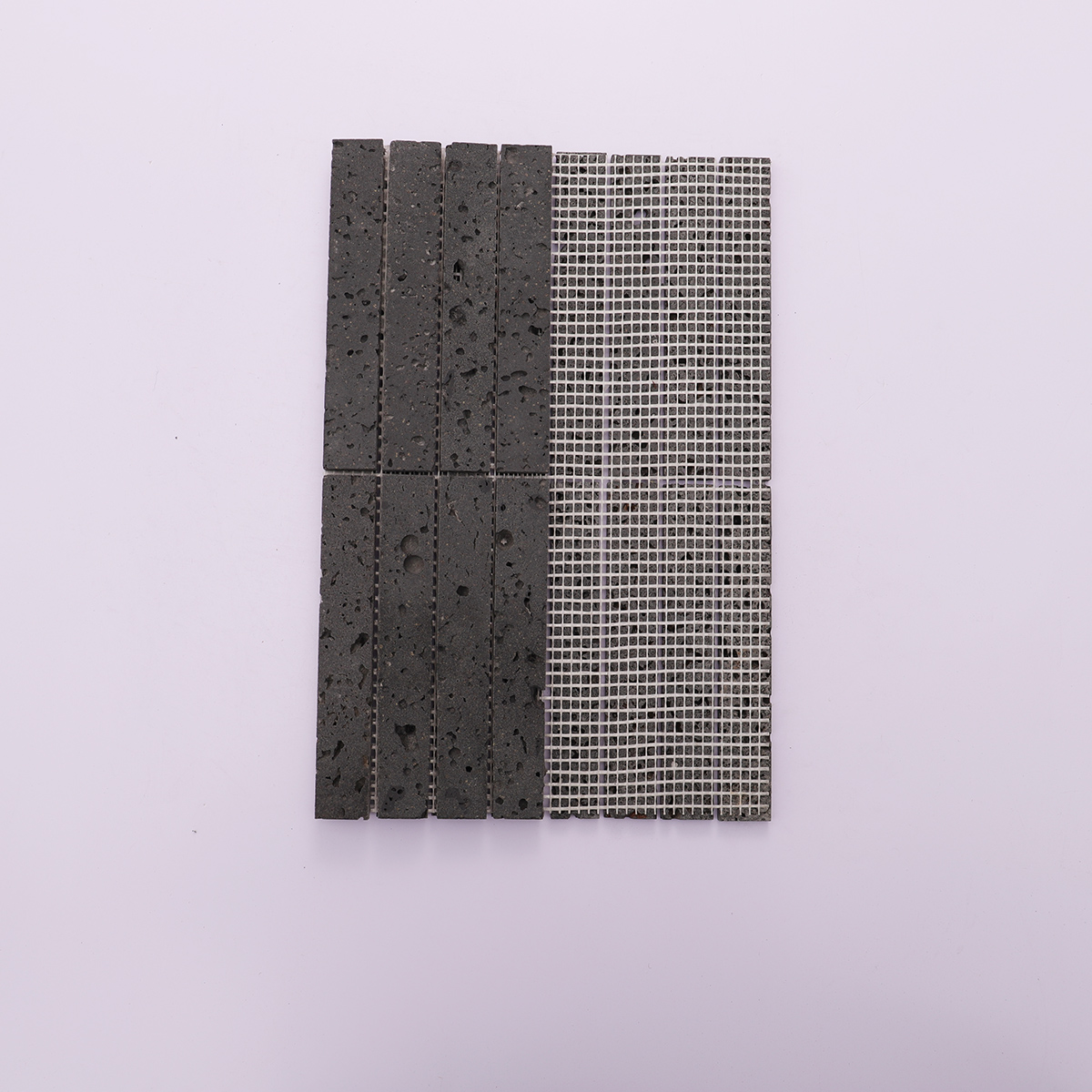 Back view showing the mesh backing of the black stone mosaic tile.