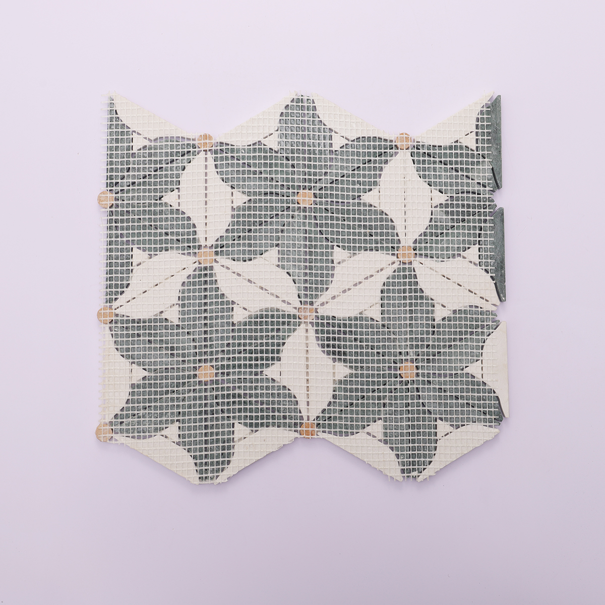 Back view with mesh backing of the green and white marble flower mosaic tiles.