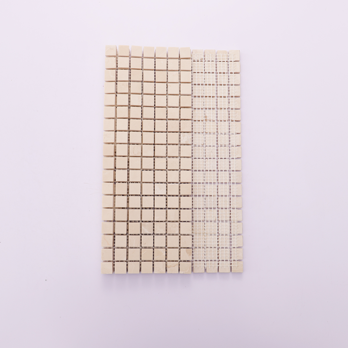 Back view of beige square polished marble mosaic tiles with mesh backing.
