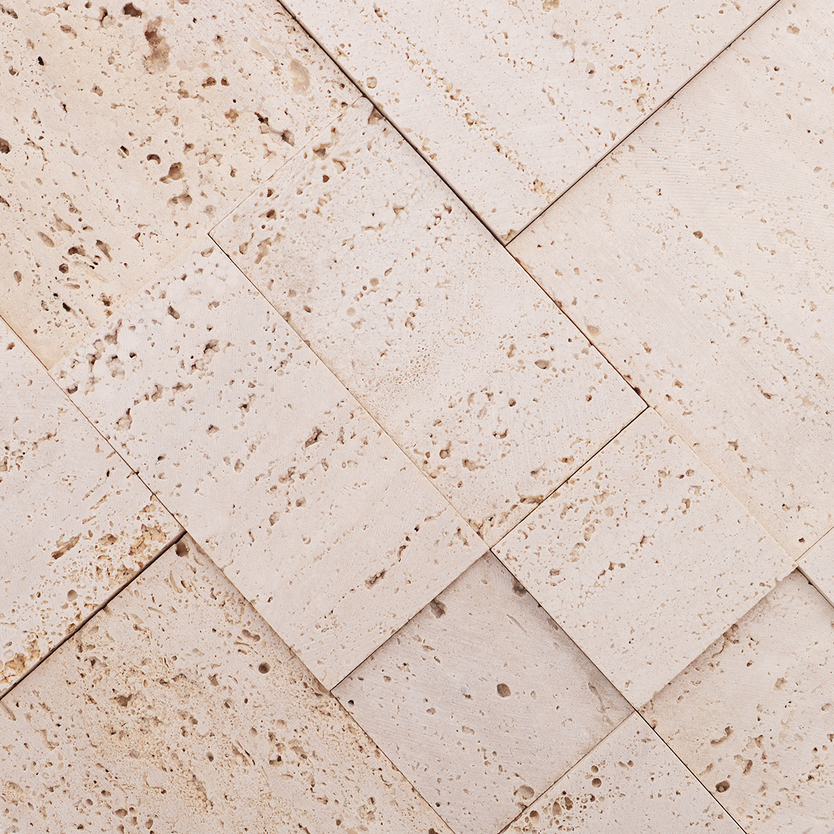 Detailed view highlighting the depth and texture of the beige travertine 3D mosaic tiles.