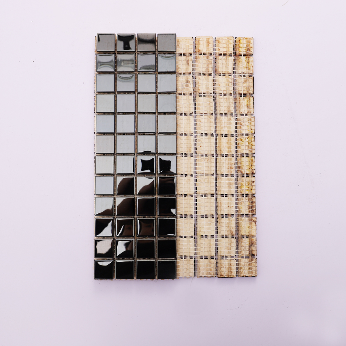 Back view of square mirror black stainless steel tiles with mesh backing