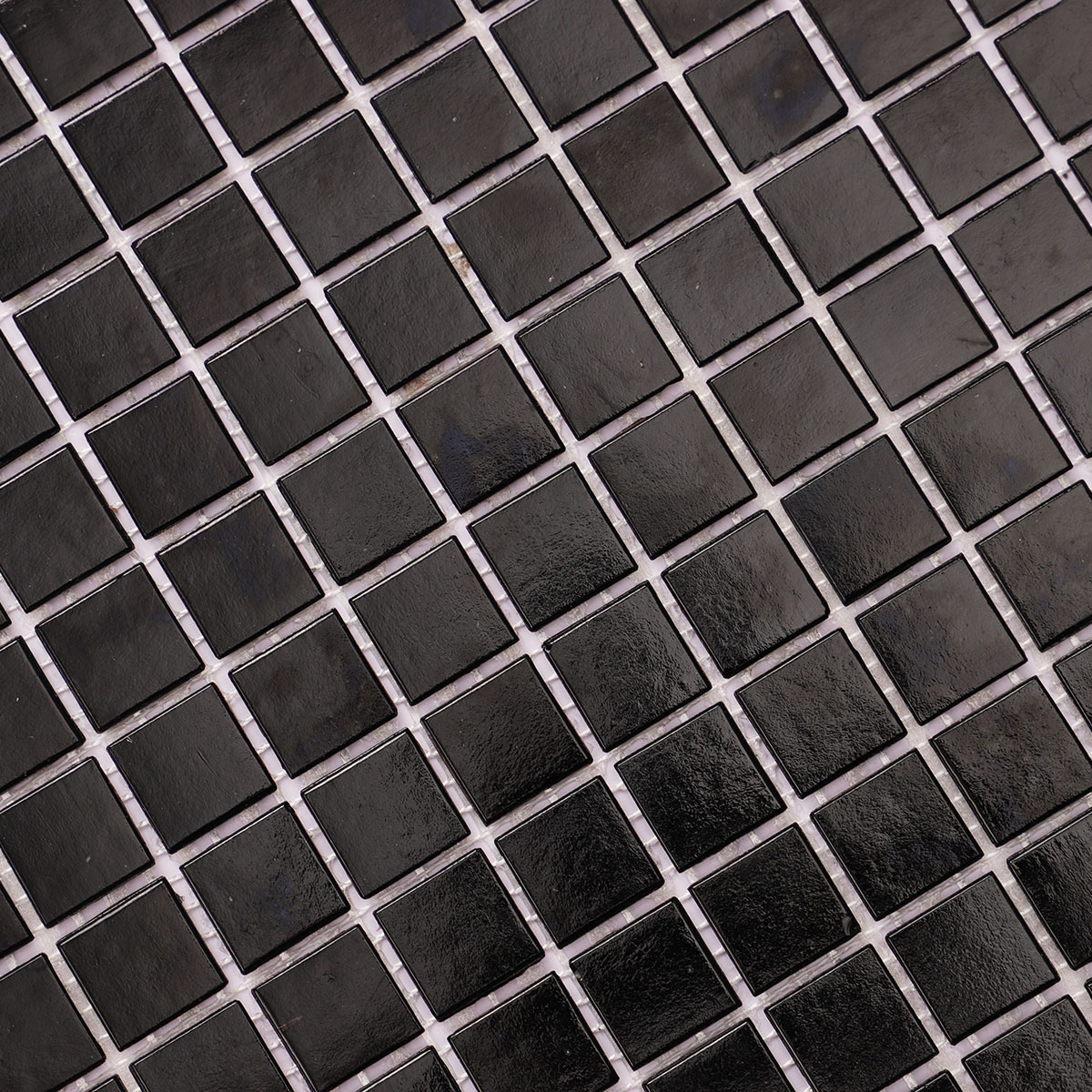 Close-up view of black fired earth glass square mosaic tiles 20mm x 20mm.