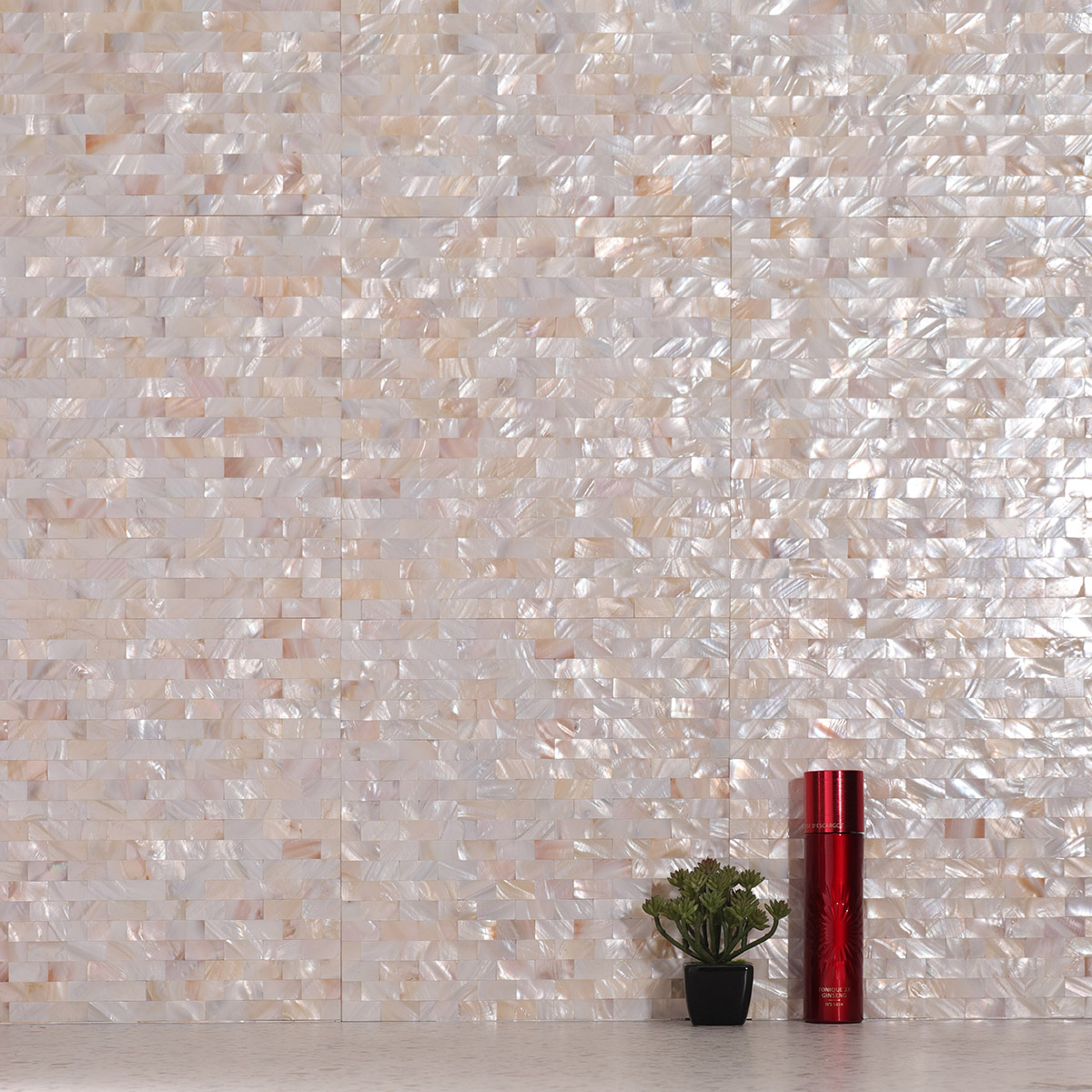 Bathroom wall with tight joint mother of pearl subway mosaic tiles