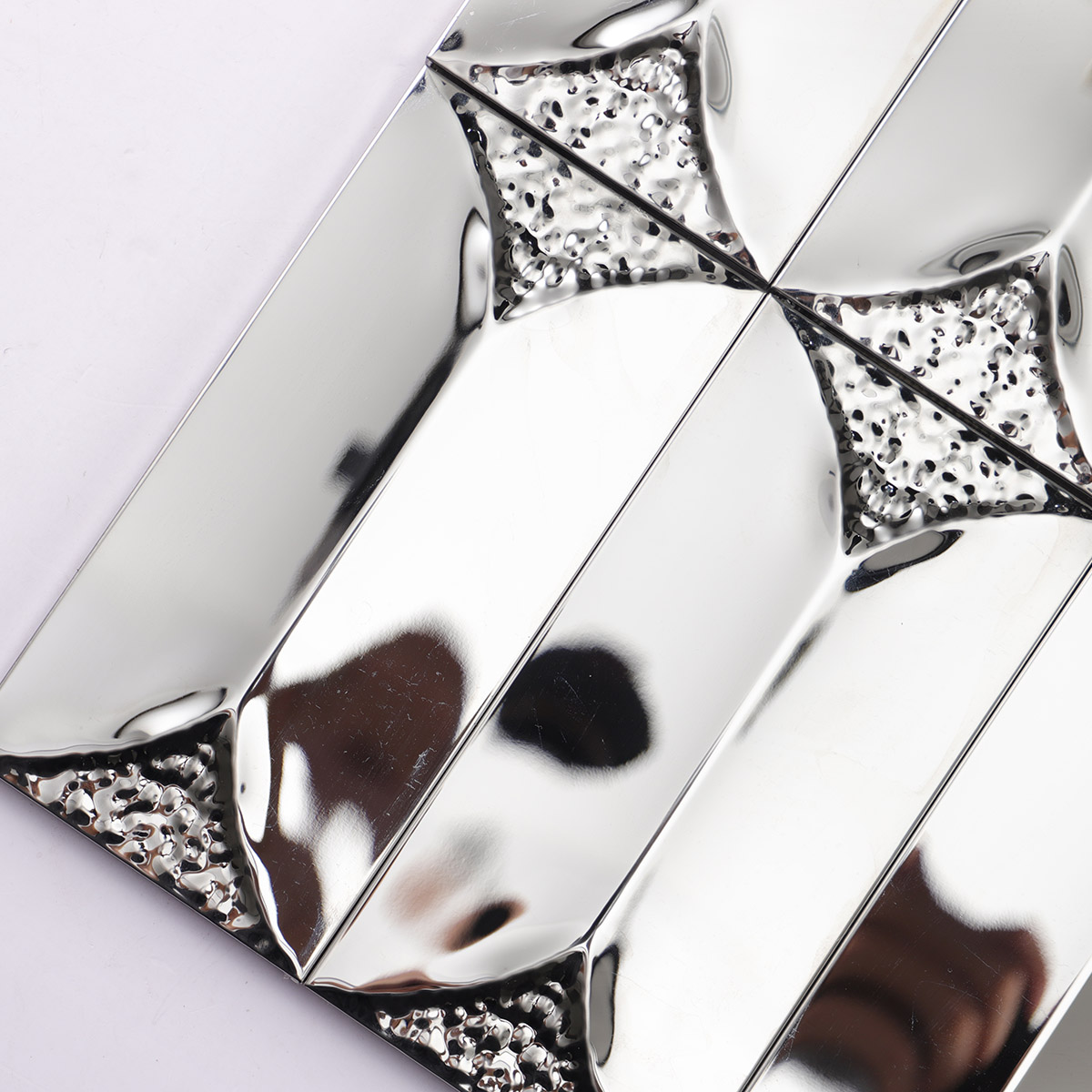  close-up of 3D glossy silver rectangle metal mosaic tiles