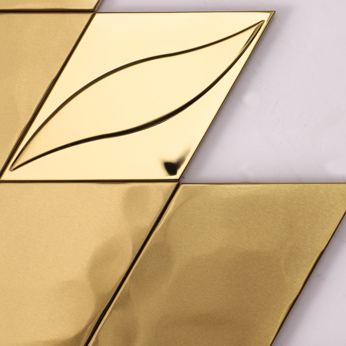 Close-up of 3D golden diamond stainless steel mosaic, matte and glossy particles mix