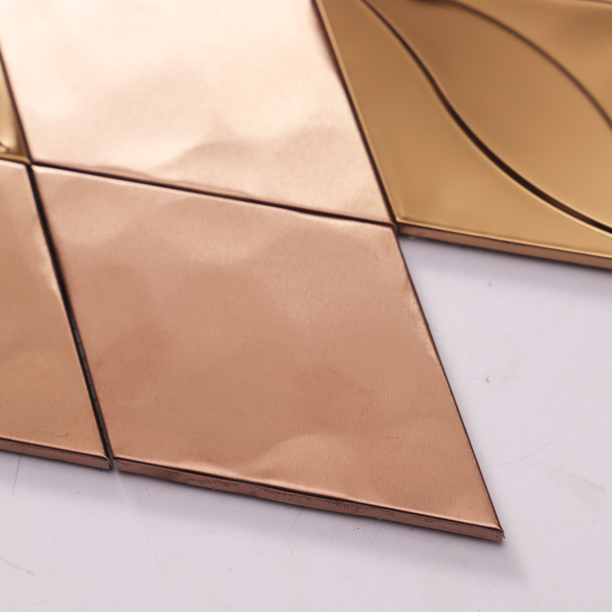 Close-up of particles on rose gold diamond metal mosaic tiles