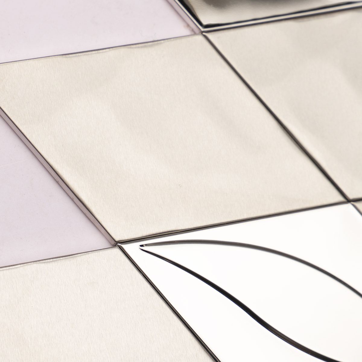 Second close-up of particles on mirror silver diamond stainless steel mosaic tiles.