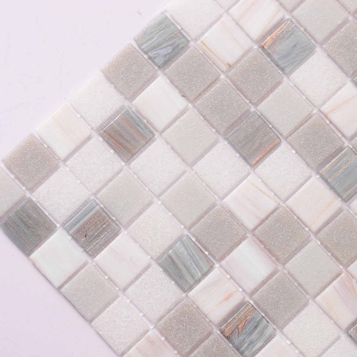 Side close-up of gray and white glass mosaic tiles