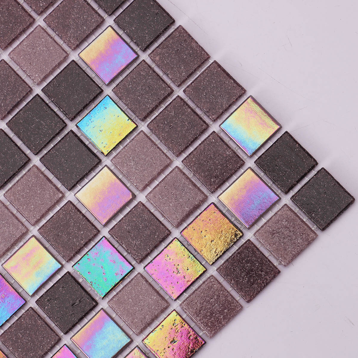 Side close-up of purple uniform square glass mosaic tiles