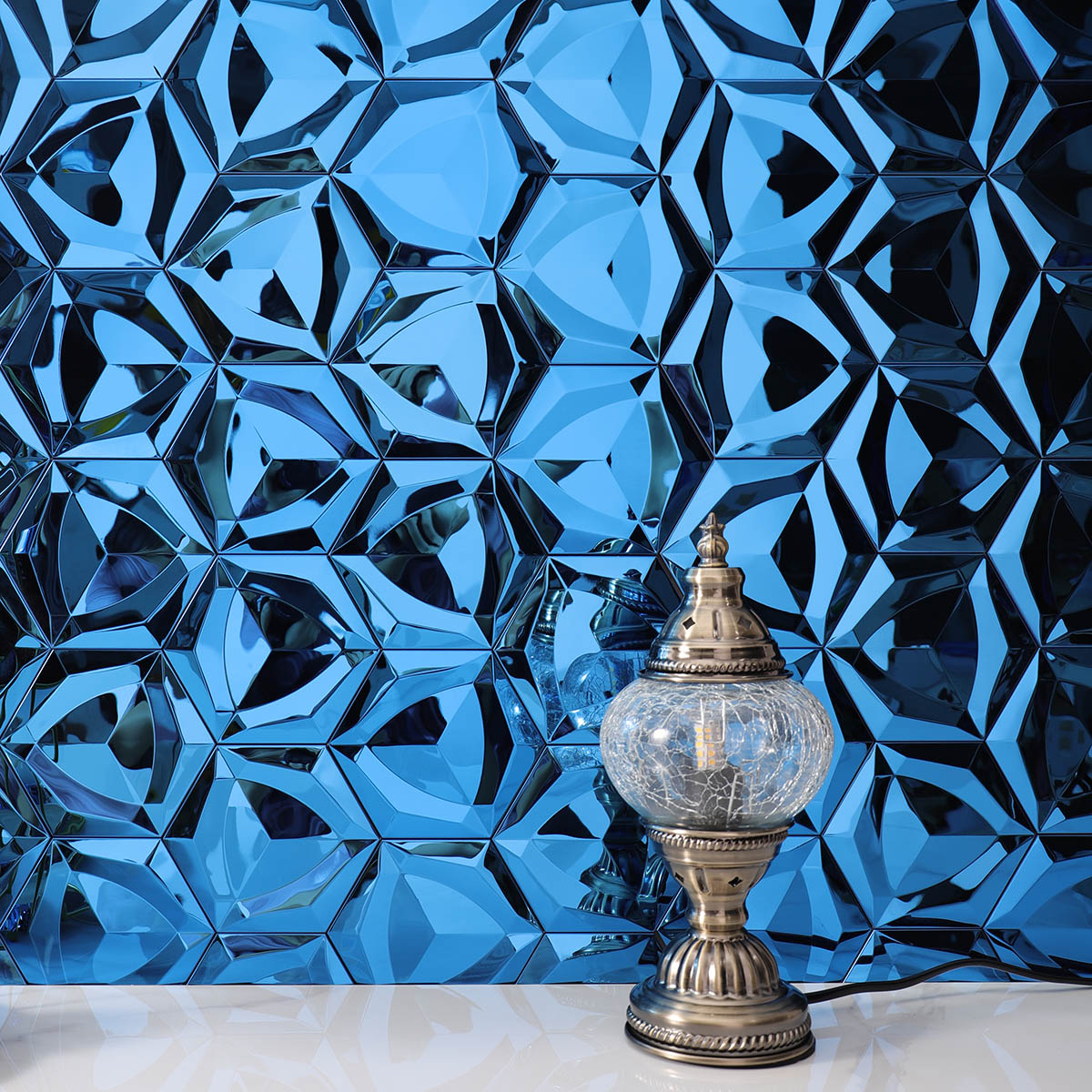 Accent wall with 3D blue hexagon stainless steel mosaic tiles.