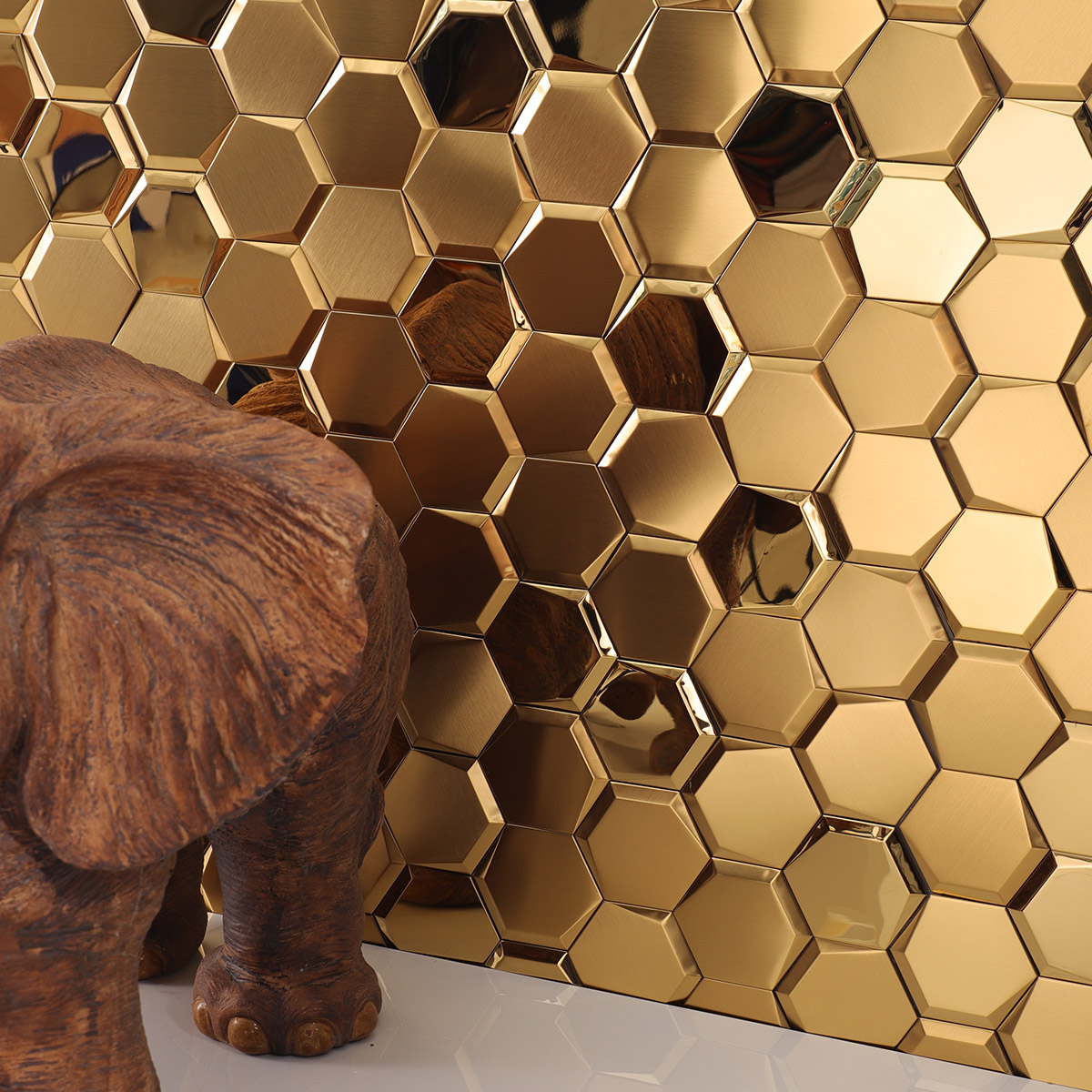 Accent wall with mirror hexagon gold stainless steel mosaic tiles and white floor tiles