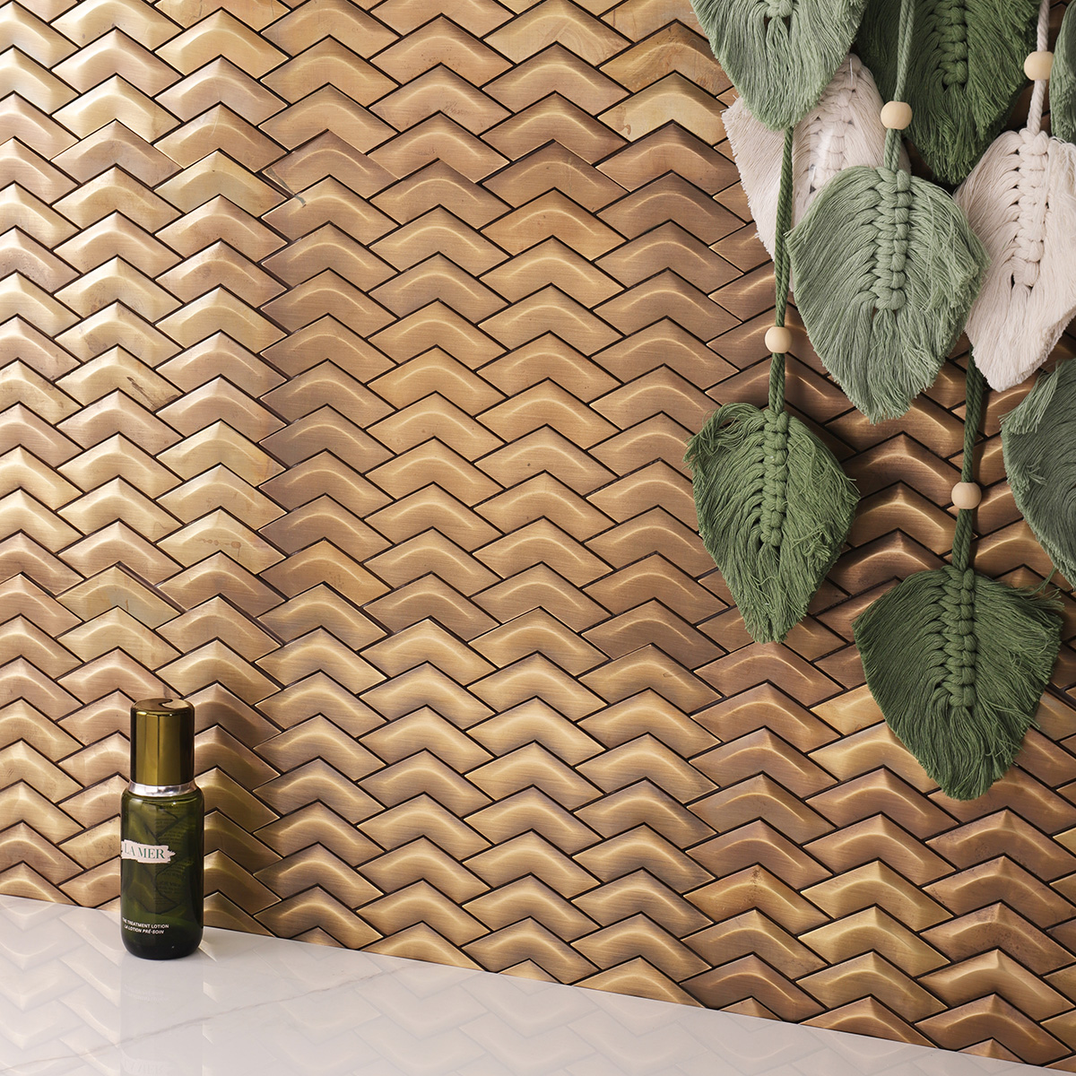 Elegant Chevron Brass Metal Mosaic Wall Tile with white floor tiles, creating a sleek interior look