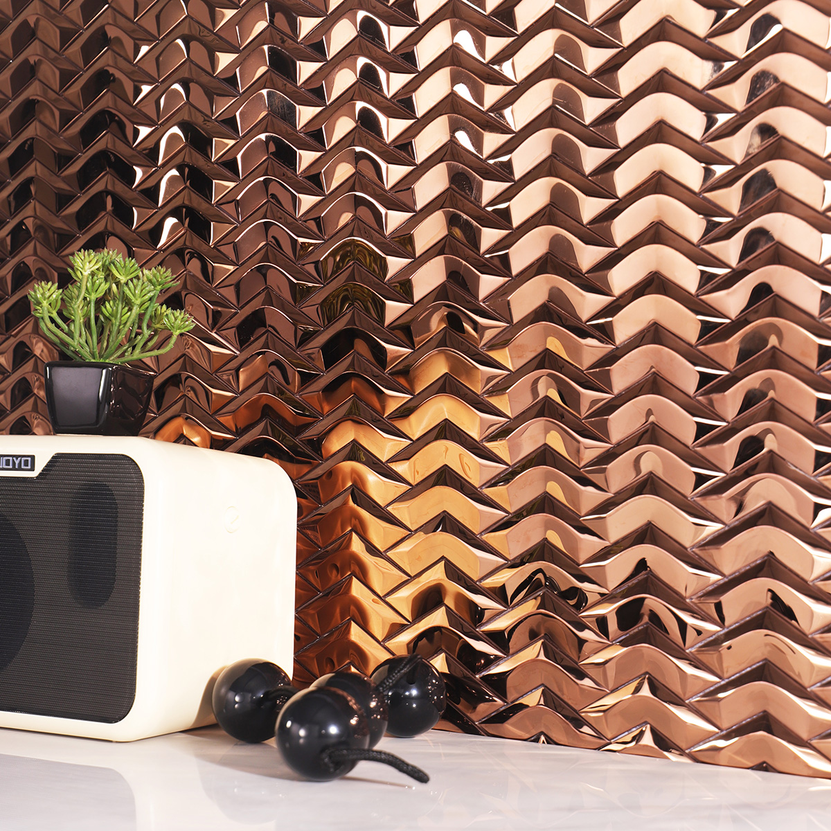 Stylish interior with 3D Herringbone Rose Gold Mosaic wall tiles, white floor tiles