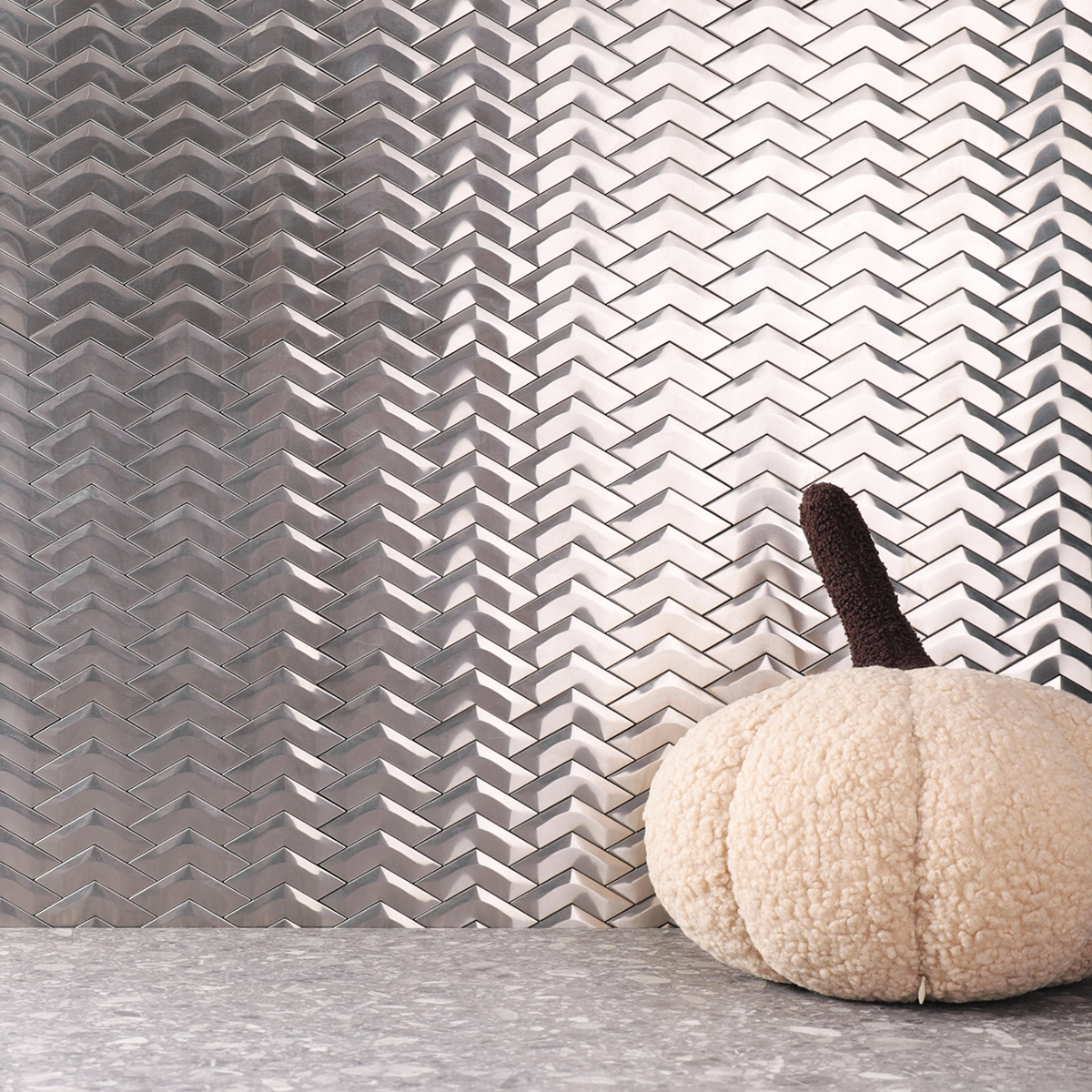 3D Silver Stainless Steel Herringbone Mosaic Tiles on a wall, gray flooring