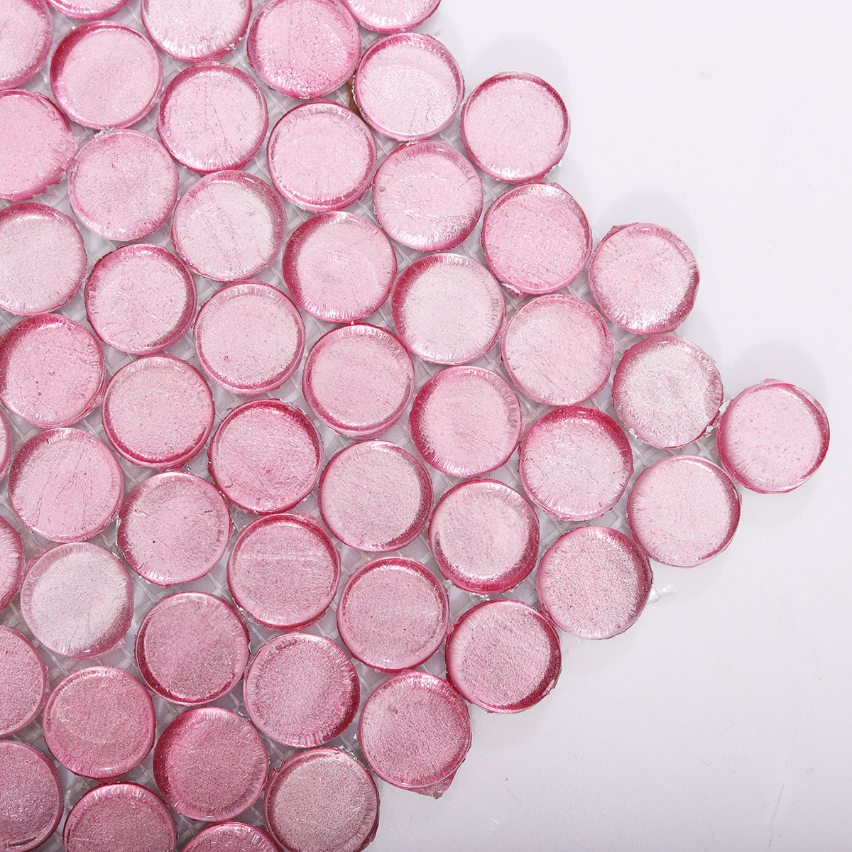 Close-up of Glossy Pink Penny Round Glass Mosaic Tile Surface