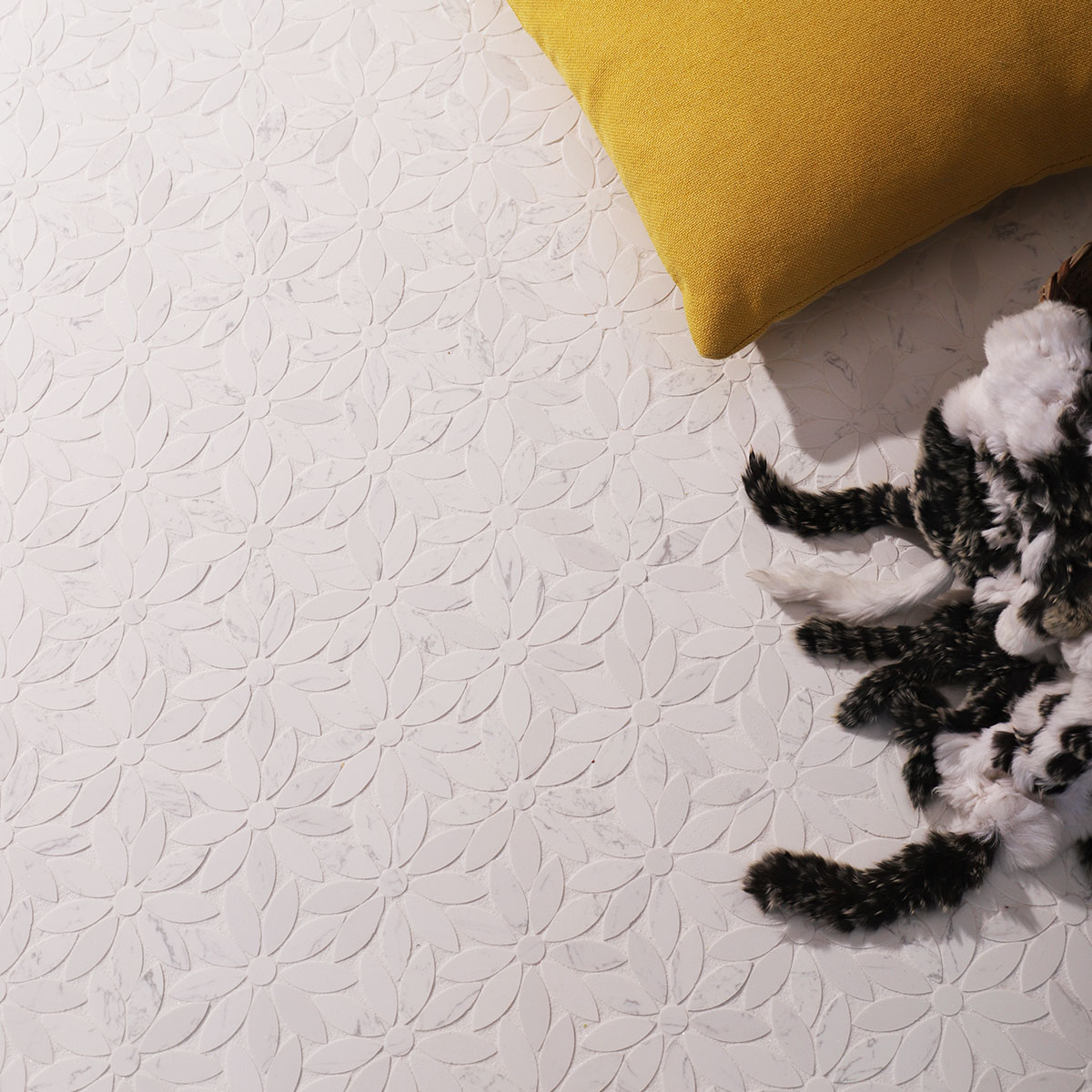 White marble mosaic tile with daisy pattern, featuring soft tones and a clean design