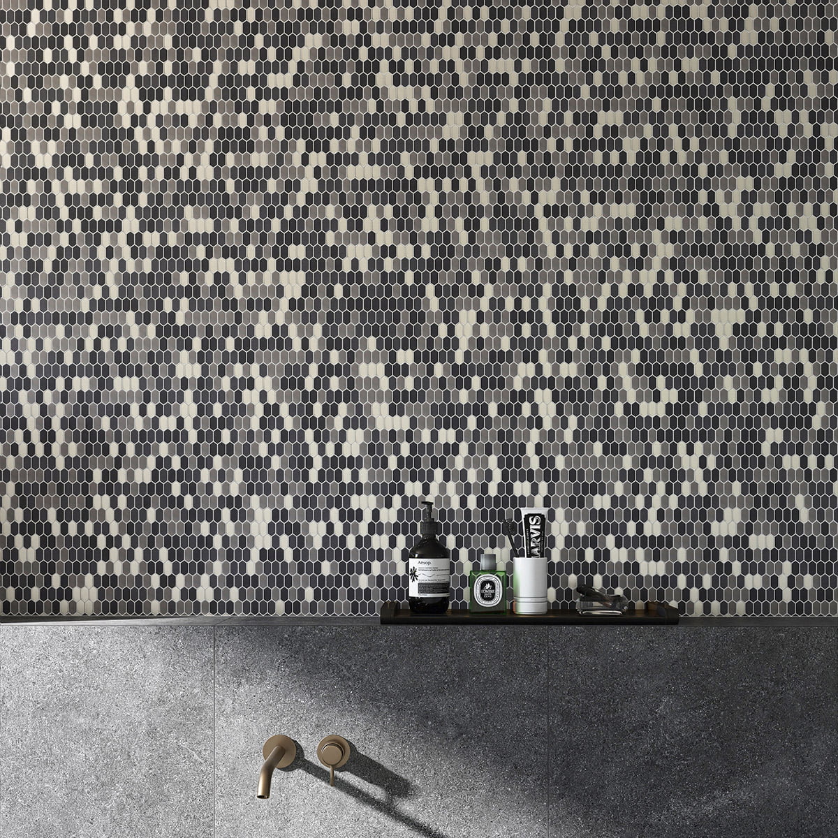 Interior design featuring gray and metallic mosaic tiles on the wall