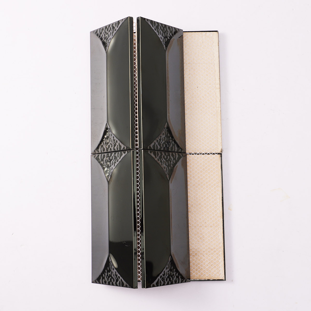 Back side of 3D black mirror metal rectangle mosaic tiles, folded.