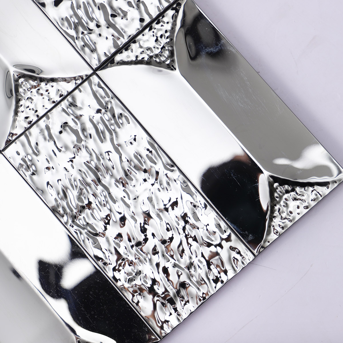 Close-up of 3D stainless silver rectangle mosaic tiles