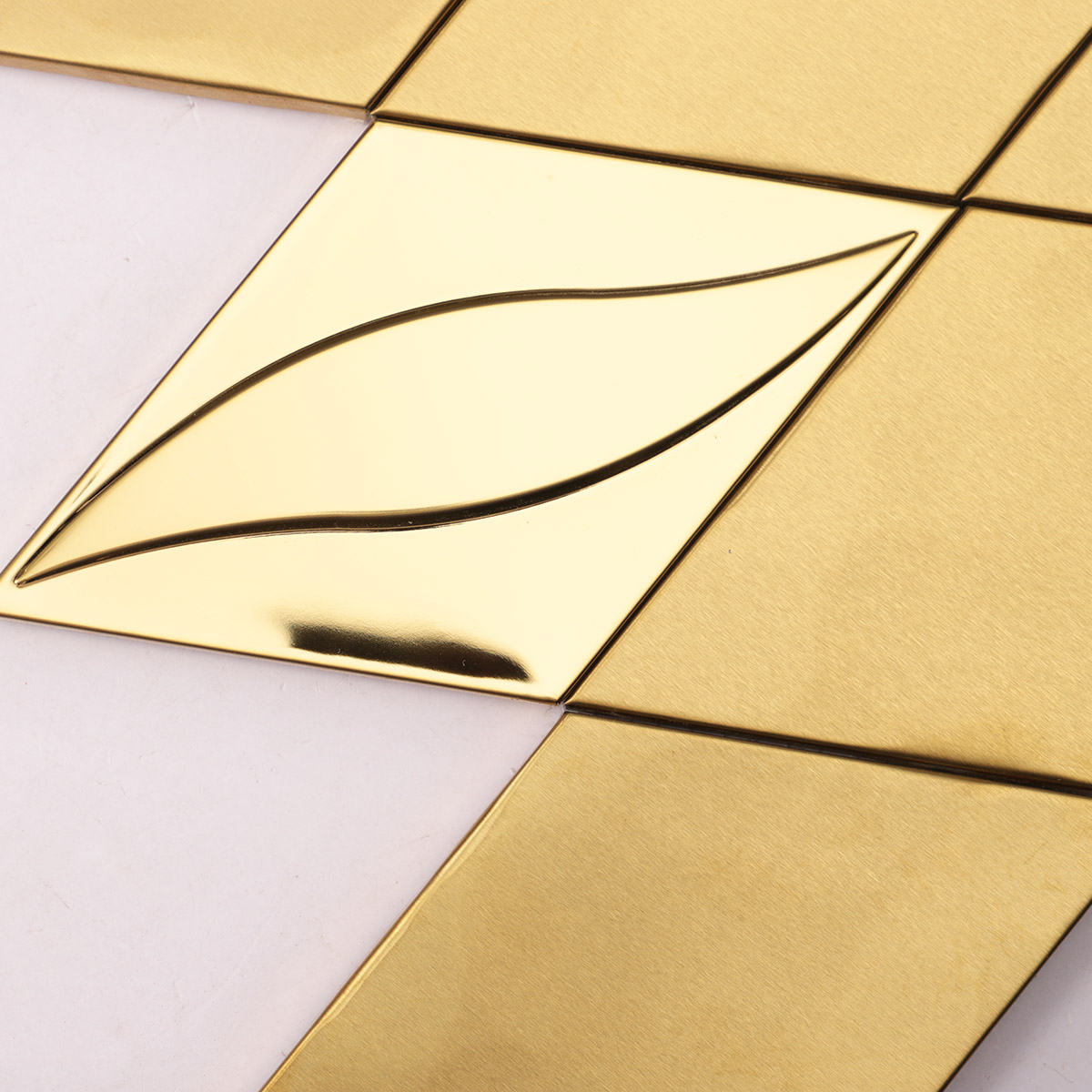 Close-up of the side of 3D golden diamond stainless steel mosaic tiles