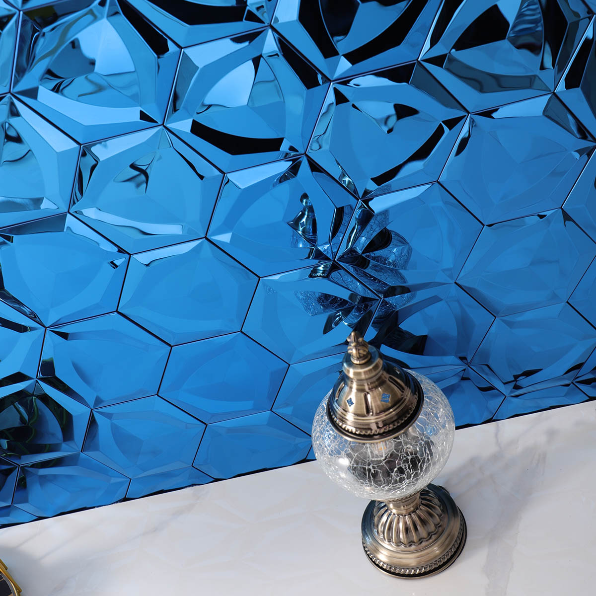 3D blue hexagon stainless steel mosaic tiles on the wall.