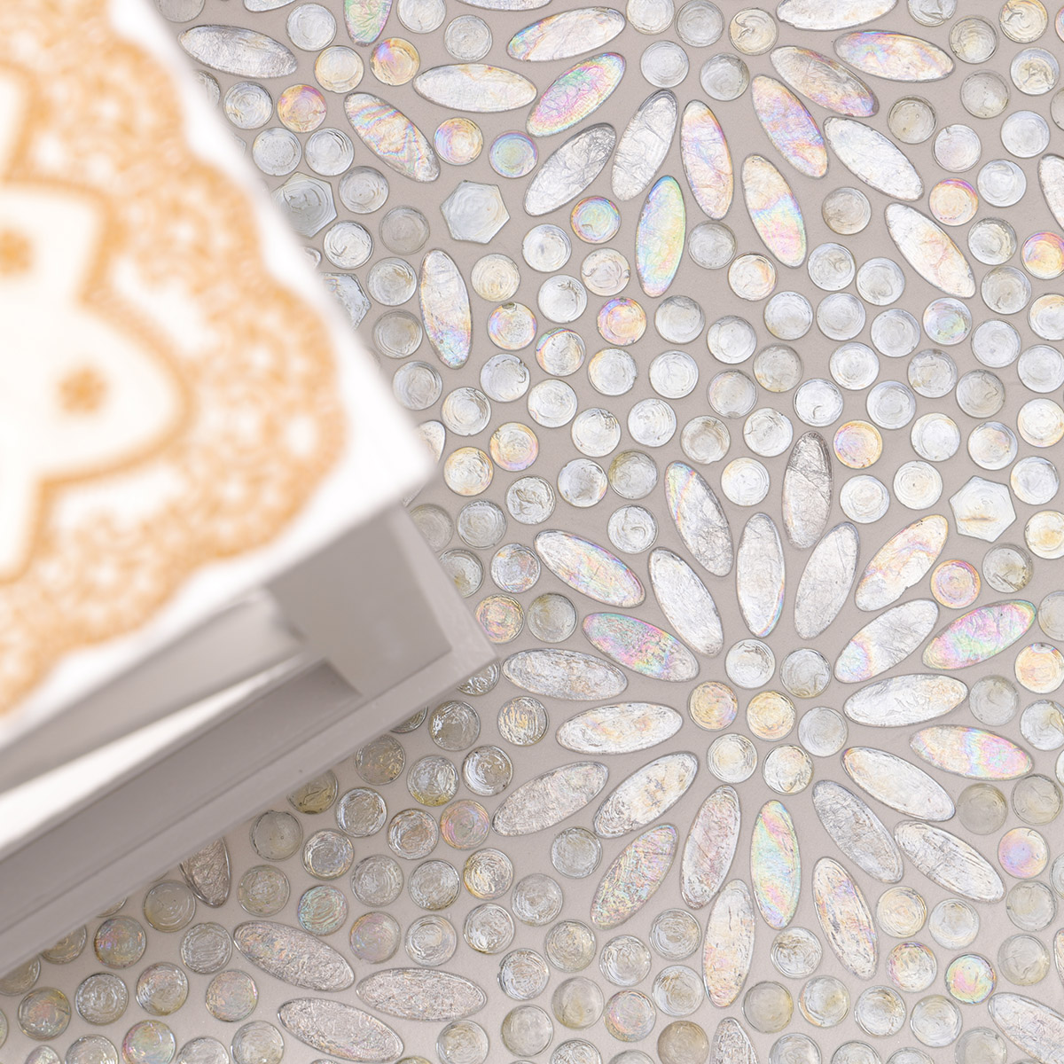 Elegant space with Opalescent Oval Flower Glass Mosaic Floor Tiles, featuring a white table 