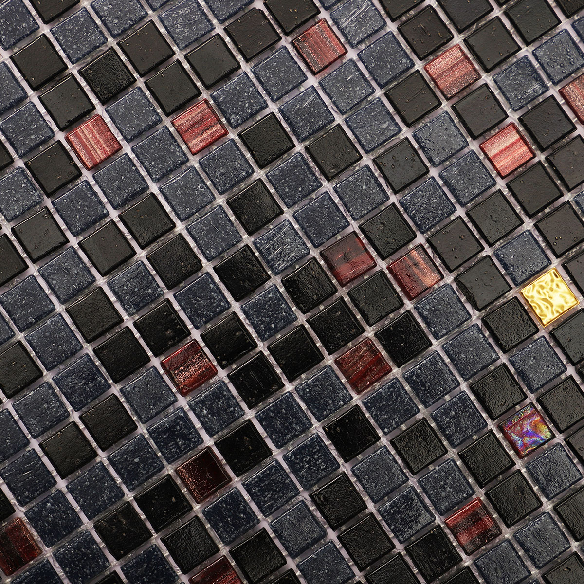 Macro close-up of black mixed glass micro mosaic tiles with gold.