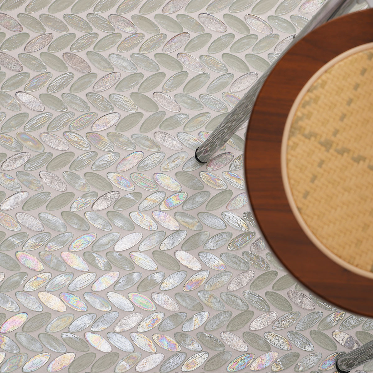 Floor scene with Iridescent White Oval Glass Mosaic Tiles and a stool